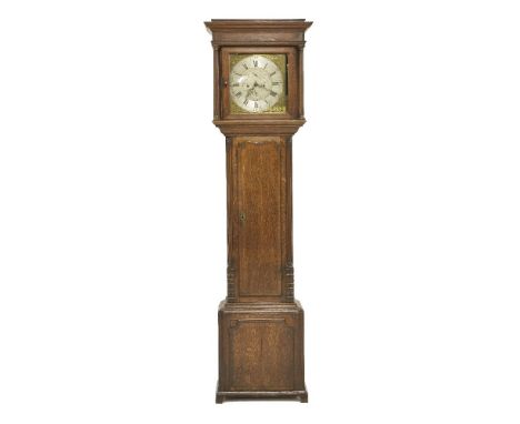 A George III oak and mahogany crossbanded longcase clock, the square 11.5in brass dial with Roman numerals, on a silvered cha