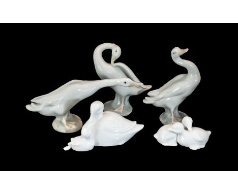 Collection of Three Lladro Geese Figures, comprising one honking, one upright and one back scratching.  Together with two Coa