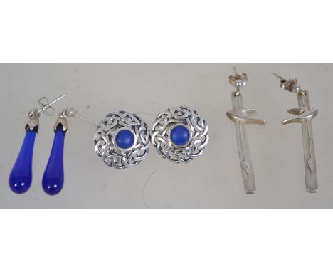 Three pairs of silver 925 earrings to include a Celtic knot shield pair with central blue stone, a pair of silver and lapis l