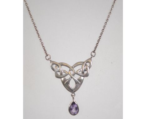 A silver 925 rolo link necklace chain with c clasp having a Celtic knot pendant with faceted purple tear drop stone drop by S
