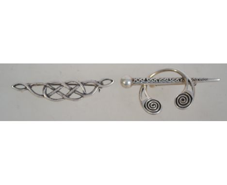 Two silver 925 brooches one being a Celtic knot bow brooch and the other being a Celtic cloak pin style brooch. Total weight 