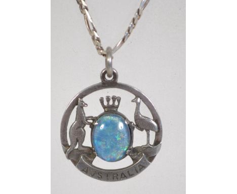 A silver fob pendant bearing the Australian coat of arms having a central opal triplet stone depicting a kangaroo and emu eit