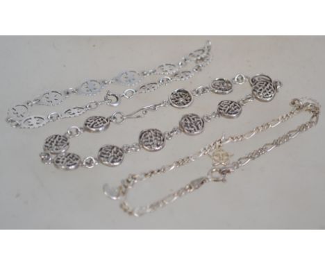 Three silver 925 bracelet chains one having Celtic knot shield spacers and hook clasp, one having flower spacers with spring 