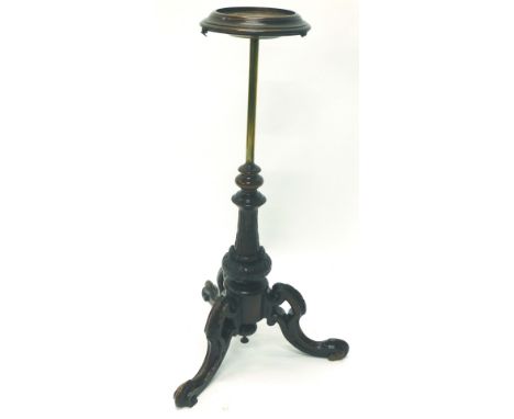 A Victorian mahogany pole screen base, later adapted for a smoker's stand, the tripod base with carved decoration, 86cm H.