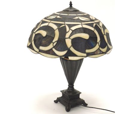 A late 20thC Tiffany style table lamp, with stained glass leaded shade and bronzed base, 66cm high.