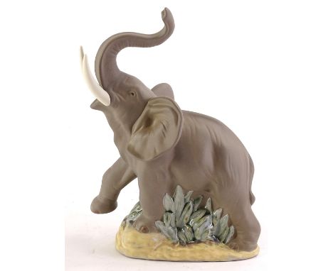 A Nao matte glazed porcelain figure of a rearing elephant, boxed 19cm wide