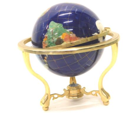 A Franklin Mint table globe, inlaid with semi precious stones, mother of pearl etc., on a brass base, 44cm diameter