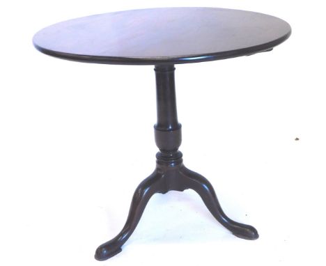 A 19thC mahogany occasional table, the circular tilt top on a turned column and tripod base. 50cm D