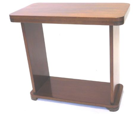 An Art Deco style mahogany rectangular table, on end supports with block feet. 65cm W.