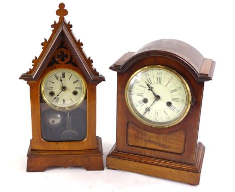 A mahogany mantel clock, the enamel dial with Roman numerals, German Junghans brass movement, 34cm high, and an American Goth