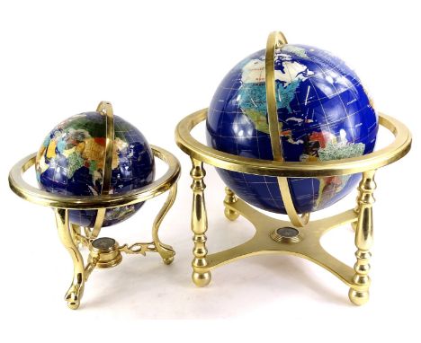 A late 20thC table globe, inlaid with semi precious stones, mother of pearl etc., on a brass base, 41cm diameter and another 