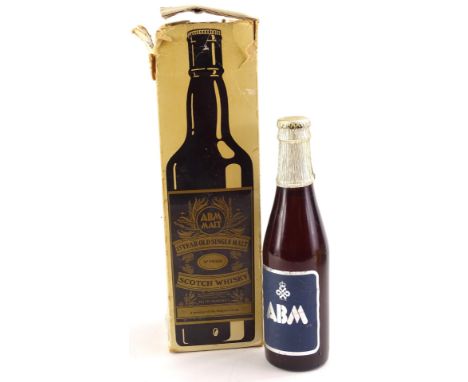 A bottle of ABM 15 years old malt whisky, and a small bottle of ABM commemorative ale.