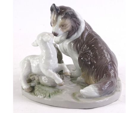 A Nao porcelain figure group, modelled in the form of a sheep dog and lamb, 16cm wide. (boxed)