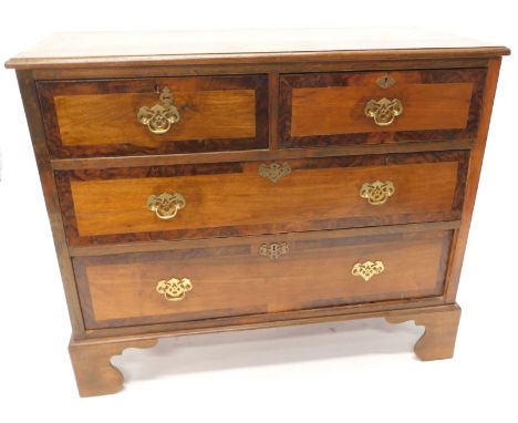 A 19thC mahogany and walnut chest of drawers, the rectangular top with a moulded edge with two short and two long drawers on 