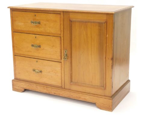 A late 19thC stained pine side cabinet, with a rectangular top with a moulded edge above three drawers and a panelled door on