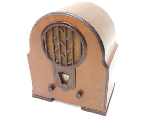 An Art Deco Phillips Super Inductance radio, with walnut and Bakelite case, model 634a, 48cm high, 42cm wide. 