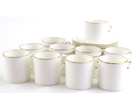 A Royal Worcester part coffee service, with a gilt border, impressed mark in black to underside