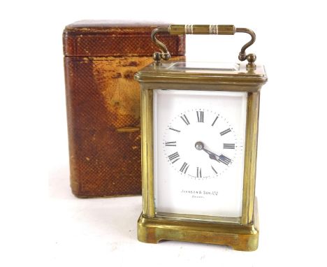 A French brass carriage timepiece, with the enamel dial bearing name Johnson & Sons Limited, Derby, with Roman numerals, in a