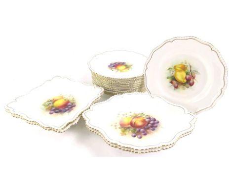 A Royal Worcester porcelain dessert service, each piece decorated with fruit by Roberts, on a white ground with beaded and gi
