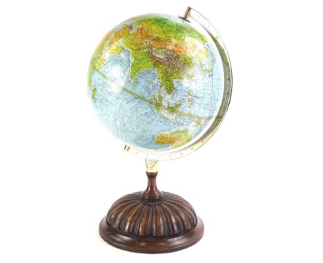 A 20thC Danish table globe, on a turned mahogany stand with chrome arm support, 52cm high.