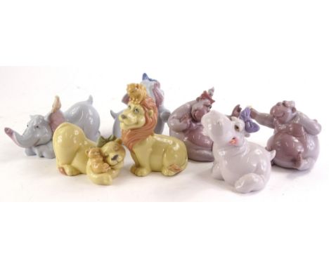 A collection of Nao porcelain comical and Disney type characters, to include lions, monkeys, elephants and a hippo.