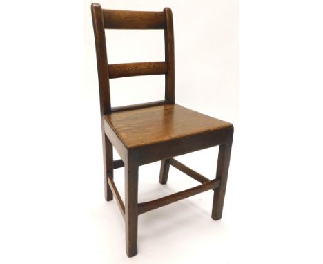 A 19thC oak country made ladder back chair, with a solid seat on square section legs with stretchers.