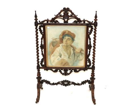 A Victorian Carved Rosewood Fire Screen, mid 19th century, with acanthus scrolled frame and spiral turned supports containing
