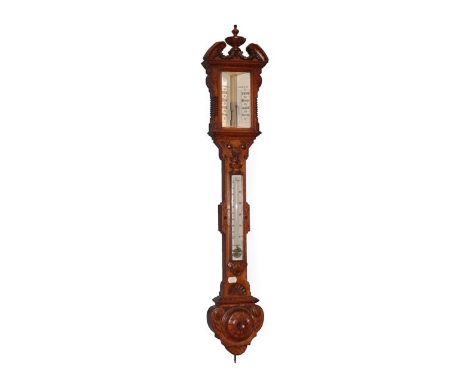 ~ A Victorian Carved Oak Stick Barometer, circa 1850, swan neck pediment with a central carved urn shaped finial and swag dec