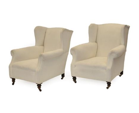 A Pair of Victorian Wing-Back Armchairs, recovered in light cream floral cut fabric, on tuned walnut forelegs with castors, 8