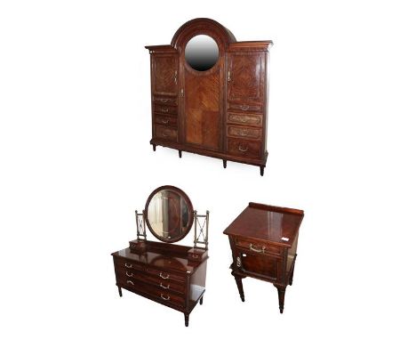 A Good Quality Mahogany and Gilt Metal Mounted Three-Piece Bedroom Suite, circa 1900, comprising a wardrobe with arched canop