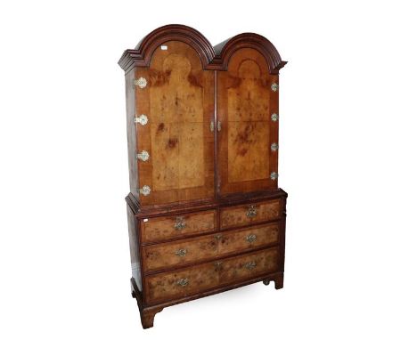 A Figured Walnut, Crossbanded and Featherbanded Dome-Top Cabinet, mid 20th century, in George I style, with quarter-veneered 