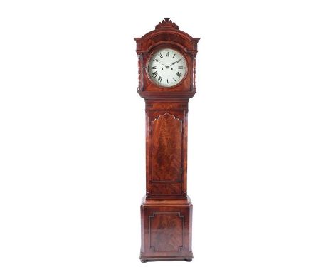 A Mahogany Eight Day Longcase Clock, early 19th century, arched pediment with a central scroll cresting, turned columns, arch