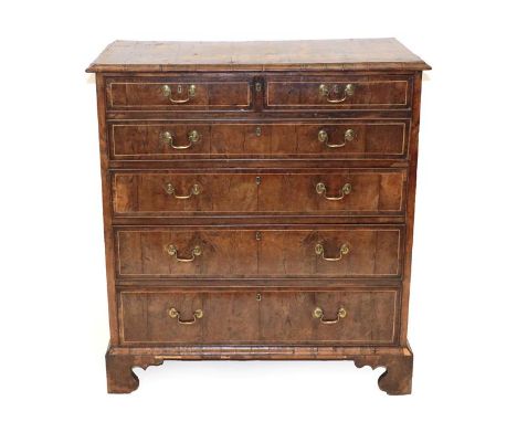 A George I Burr Yewwood Veneered and Mahogany Sided Secretaire Chest, early 18th century, the moulded top above a deep fall f