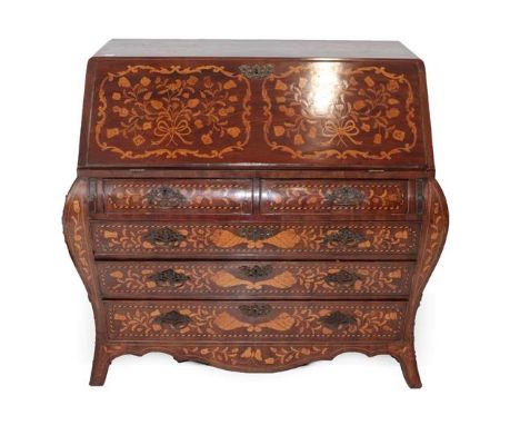 A 19th Century Dutch Mahogany and Marquetry Inlaid Bureau, of bombé shaped form, richly inlaid with foliage and flowers, the 