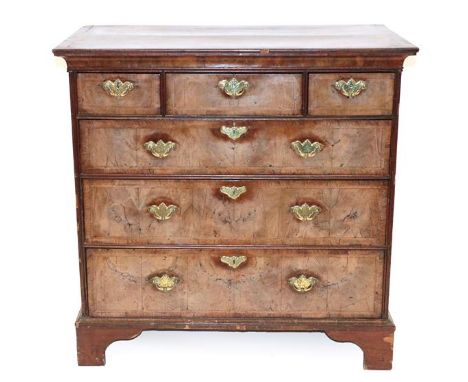 A Walnut and Featherbanded Straight Front Chest, the later oak and mahogany crossbanded top above three short and three long 