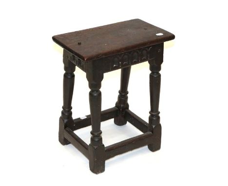 A Late 17th Century Oak Joint Stool, the four peg top above a nulled frieze and stamped R, on turned legs with block feet joi