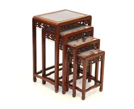 A Set of Four Early 20th Century Chinese Hardwood Nesting Tables, of rectangular moulded form, the burr moulded tops above pi