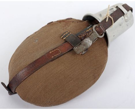 WW2 German Army Canteen: Army issue combat water canteen complete with cloth cover and black leather strap which is broken to
