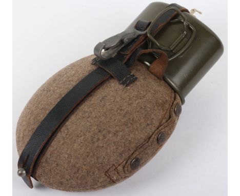 WW2 German Army Canteen: Army issue combat water canteen complete with cloth cover and black leather strap with metal clip, g