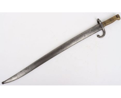 French Chassepot Bayonet: Ribbed brass handle, cross guard and top of scabbard stamped . Armourers details to the spine of th