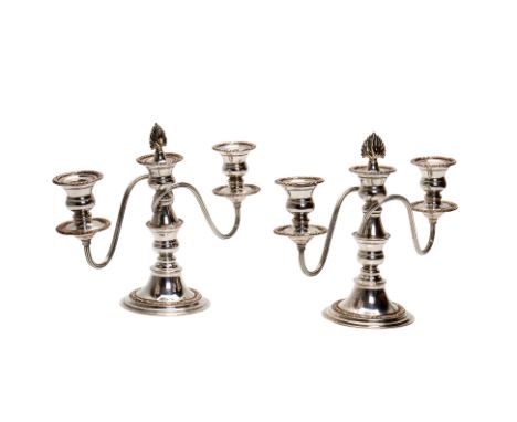 A PAIR OF ENGLISH SILVER PLATED THREE LIGHT CANDELABRA
Maker's mark P&amp;Co, 20th Century, with foliate borders and reeded b