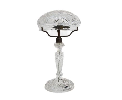 A LARGE CUT GLASS TABLE LAMP
Early-mid 20th Century, With mushroom shaped shade, on baluster stem with large circular foot, t