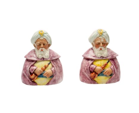 A PAIR OF EUROPEAN NOVELTY CERAMIC TOBACCO JARS
Modelled as a seated Arab figure holding a a pipe, the head and shoulders for