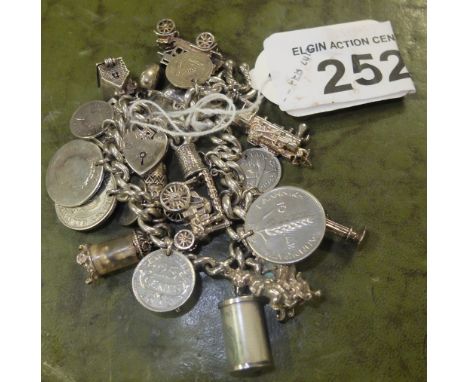  Sale Item:    LARGE SILVER CHARM BRACELET   Vat Status:   No Vat   Buyers Premium:  This lot is subject to a Buyers Premium 