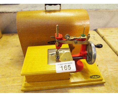  Sale Item:    GRAIN MINI SEWING MACHINE WITH COVER  Vat Status:   No Vat   Buyers Premium:  This lot is subject to a Buyers 