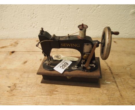  Sale Item:    SINGER SEWING MACHINE BOX & JUNE 1911 CORONATION BOOKMARK  Vat Status:   No Vat   Buyers Premium:  This lot is