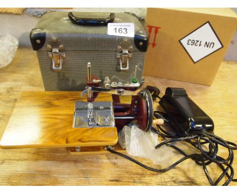  Sale Item:    ESSEX MINI SEWING MACHINE WITH FOOT PEDAL & CASE  Vat Status:   No Vat   Buyers Premium:  This lot is subject 