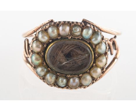 A Georgian pearl and hairwork mourning ring, centring on a glazed panel of woven hairwork (glass broken), with a surround of 