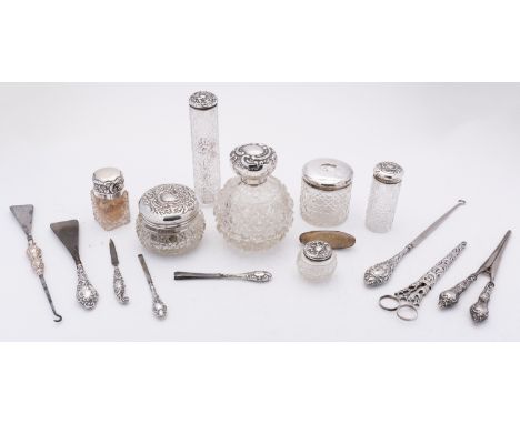 A mixed group of silver and glass including; eight various dressing table bottles and jars with silver lids, a pair of glove 