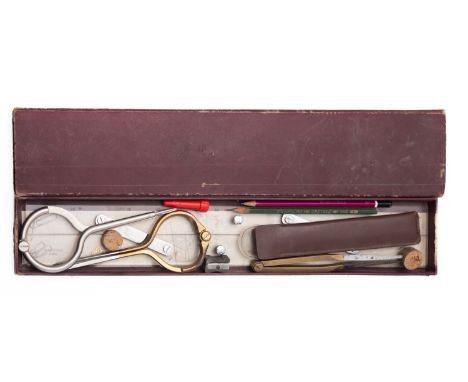 A Set of contemporary draughtsmans tools. Comprising rulers compasses and pencils in a slip case. 